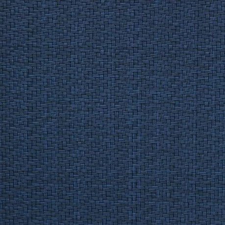 Close-up of Bodrum's Wicker Round Placemat Navy Set of 4, showing a dark blue woven texture with visible threads in a basket-weave pattern, evoking the stylish and easy-care design of modern placemats.