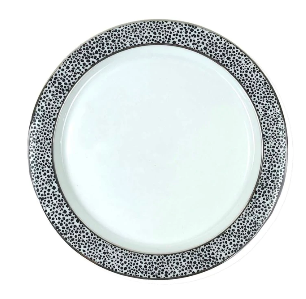 The Michael Wainwright Panthera Dinnerware Platinum features a modern white plate with a bold black and white dalmatian-like rim, adding a striking touch to your porcelain set.