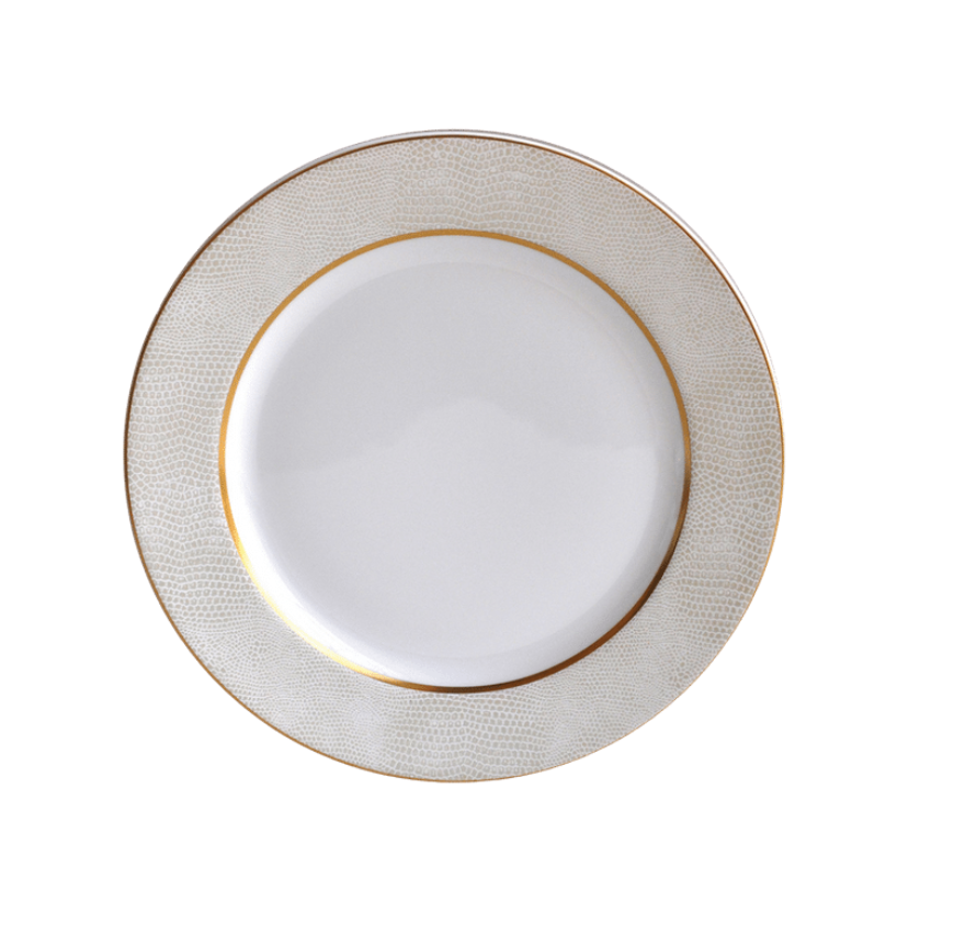 The Bernardaud Sauvage Gold Dinnerware features a white Limoges porcelain plate with a textured, light gold and white snakeskin-patterned rim and a thin gold band, displayed from above on a white background.