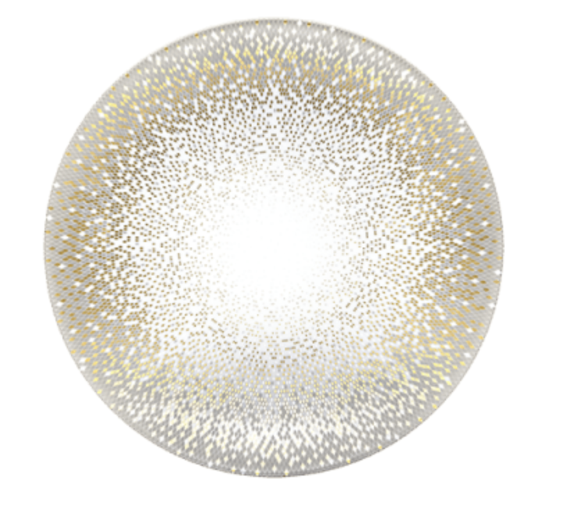 The Haviland Souffle D'or Dinnerware features a round Limoges porcelain plate with a white center, adorned with gold and silver dots in a radiant gradient toward the rim.