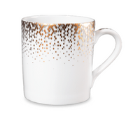 The Haviland Souffle D'or porcelain mug features a handle and is adorned with gold and dark brown geometric dotted patterns around the rim that fade gracefully down the white cup.