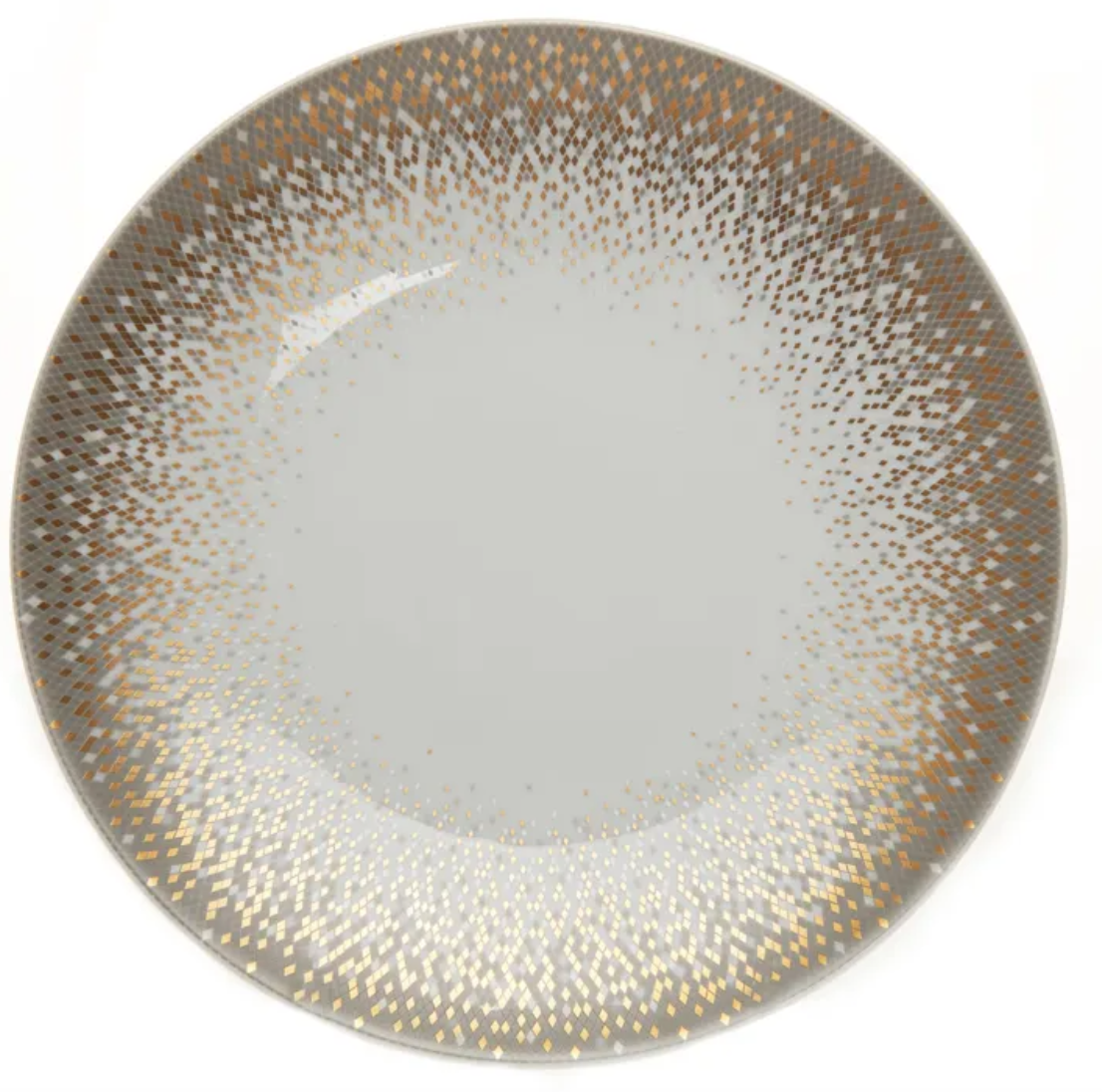 The Souffle D'or Dinnerware by Haviland is a round Limoges porcelain plate with a white center and a border of gold, silver, and bronze dots creating a gradient from the rim to the middle.