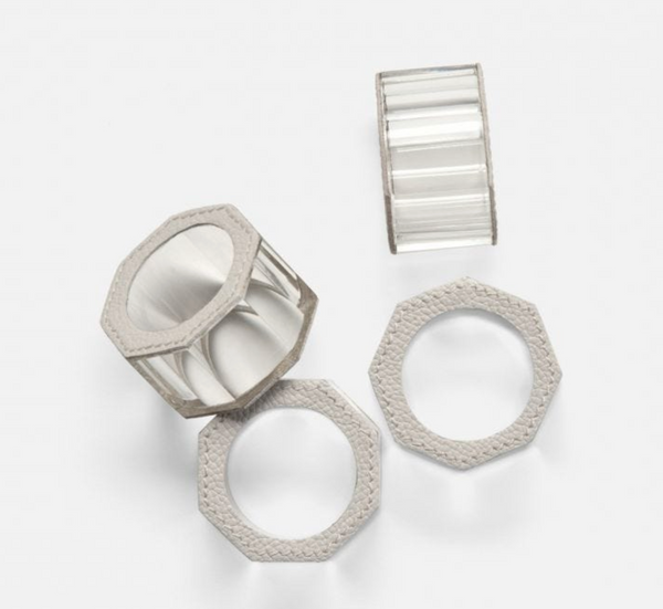 Four Arthur Leather Grey Napkin Rings by Blue Pheasant are arranged on a white background. Each features a textured leather finish, adding a touch of luxury and contemporary elegance to any table setting.