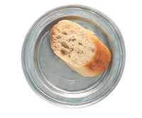 A single slice of crusty bread rests on a MATCH Convivio plate by MATCH, shown against a white background.