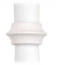 A white cloth napkin is held by L'Objet's Terra Cuff Napkin Ring, a hand-crafted, flared porcelain ring with ridged detailing. Set of 4 shown against a plain white background.