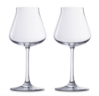 Two clear, empty Chateau Barware wine glasses with long stems by Baccarat are placed side by side against a plain white background, showcasing elegant crystal stemware.