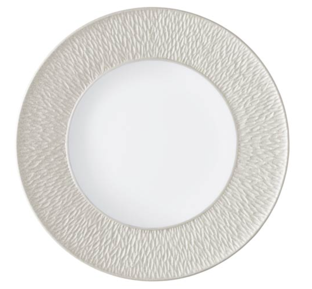 The Raynaud Mineral Irise Dinnerware Pearl Grey is a round white plate with a smooth center and a wide, textured light gray rim featuring a subtle wavy pattern, crafted from fine Limoges porcelain.