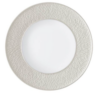 The Raynaud Mineral Irise Dinnerware Pearl Grey is a round white plate with a smooth center and a wide, textured light gray rim featuring a subtle wavy pattern, crafted from fine Limoges porcelain.