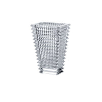 The Baccarat Eye Rectangular Vase Clear features a geometric, flared design with wavy grid-like layers along its sides and a square base, showcased against a white background.