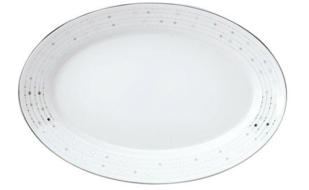 An oval white Limoges porcelain plate from Philippe Deshoulières Carrousel Dinnerware features a subtle gray dot and line pattern around the rim with a thin silver border, highlighting its elegant design.