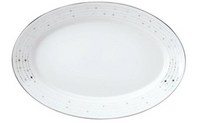 An oval white Limoges porcelain plate from Philippe Deshoulières Carrousel Dinnerware features a subtle gray dot and line pattern around the rim with a thin silver border, highlighting its elegant design.