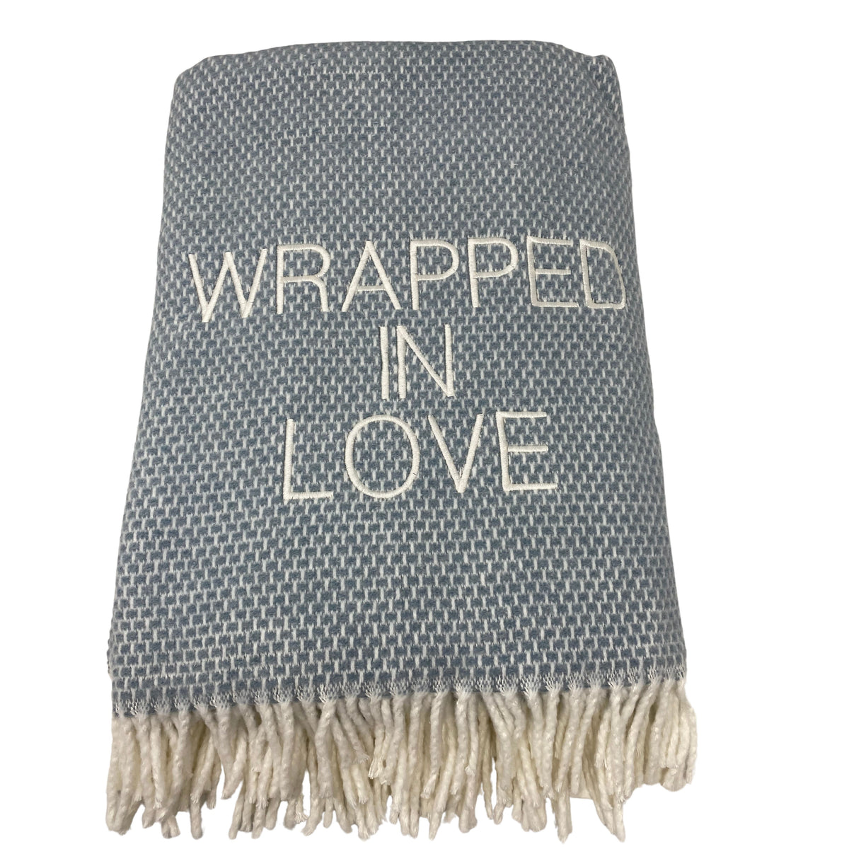 The A Soft Idea Wrapped in Love Throw is a folded gray and white woven blanket with white fringe and "WRAPPED IN LOVE" embroidered on the front. Machine washable and super soft, it’s a perfect holiday gift.