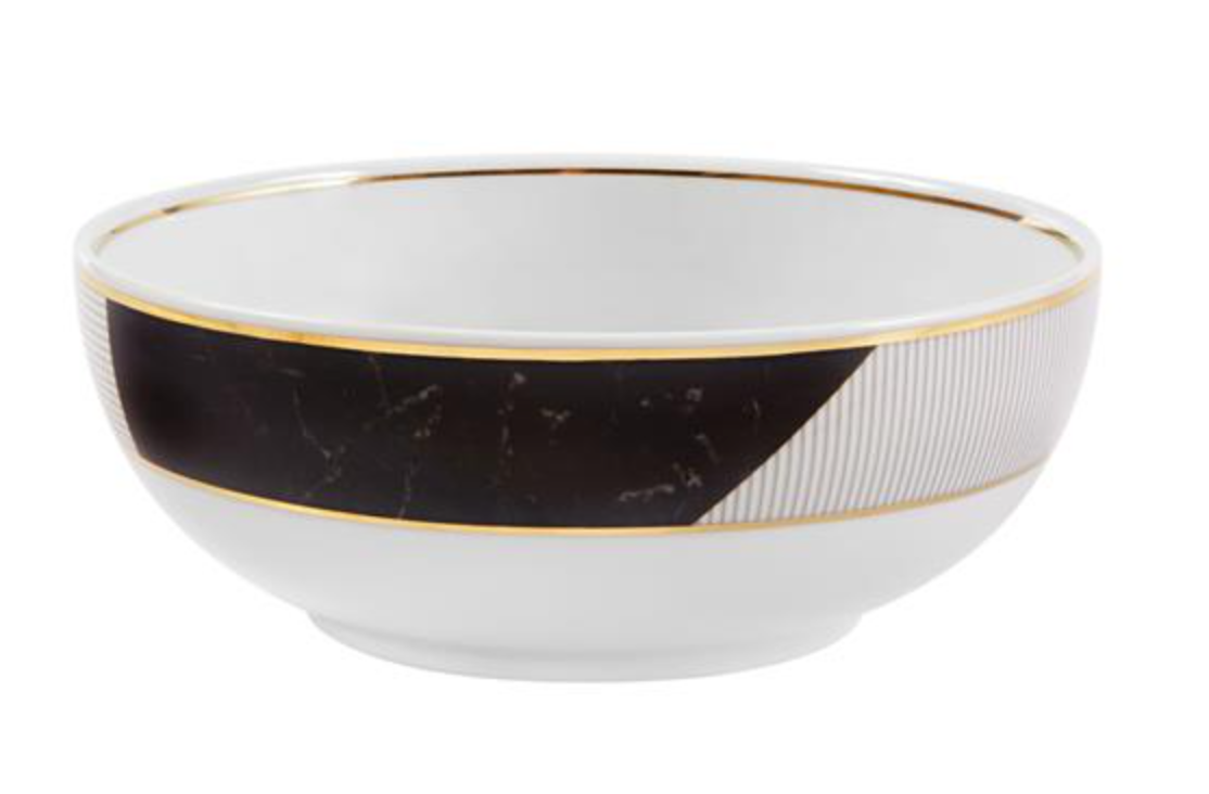 The Vista Alegre Carrara by Coline Le Corréa Dinnerware bowl features white porcelain with a gold rim and decorative black and gold geometric patterns, inspired by French designer elegance.
