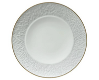 The Raynaud Mineral Irise Gold Filet Dinnerware features a round white contemporary design with a textured rim and thin gold edge, designed by Thierry Cheyrou and shown from above on a white background.