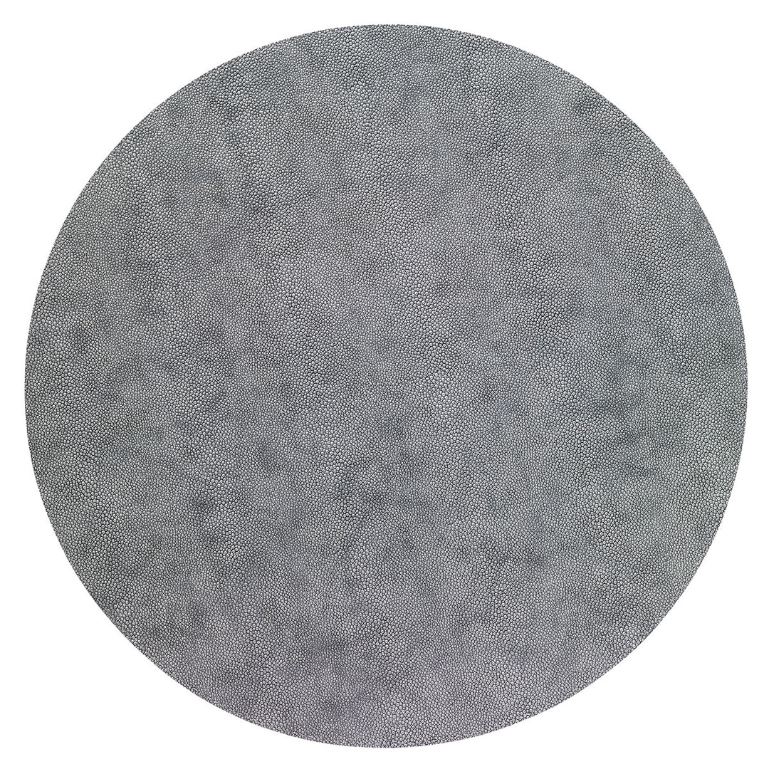 A set of 4 round, gray Stingray placemats by Bodrum, featuring a subtle dotted texture and made from phthalate-free vinyl, shown from above on a white background.