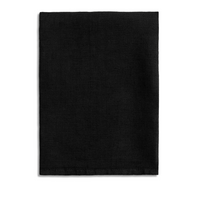 The L'Objet Linen Sateen Napkin Black Set of 4, crafted from 100% linen in Portugal, features neatly folded rectangular black napkins displayed on a white background.
