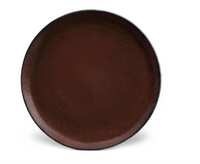 The Terra Wine Dinnerware by L'Objet is a handcrafted, round ceramic plate in dark brown with a lightly textured surface, shown against a plain white background.
