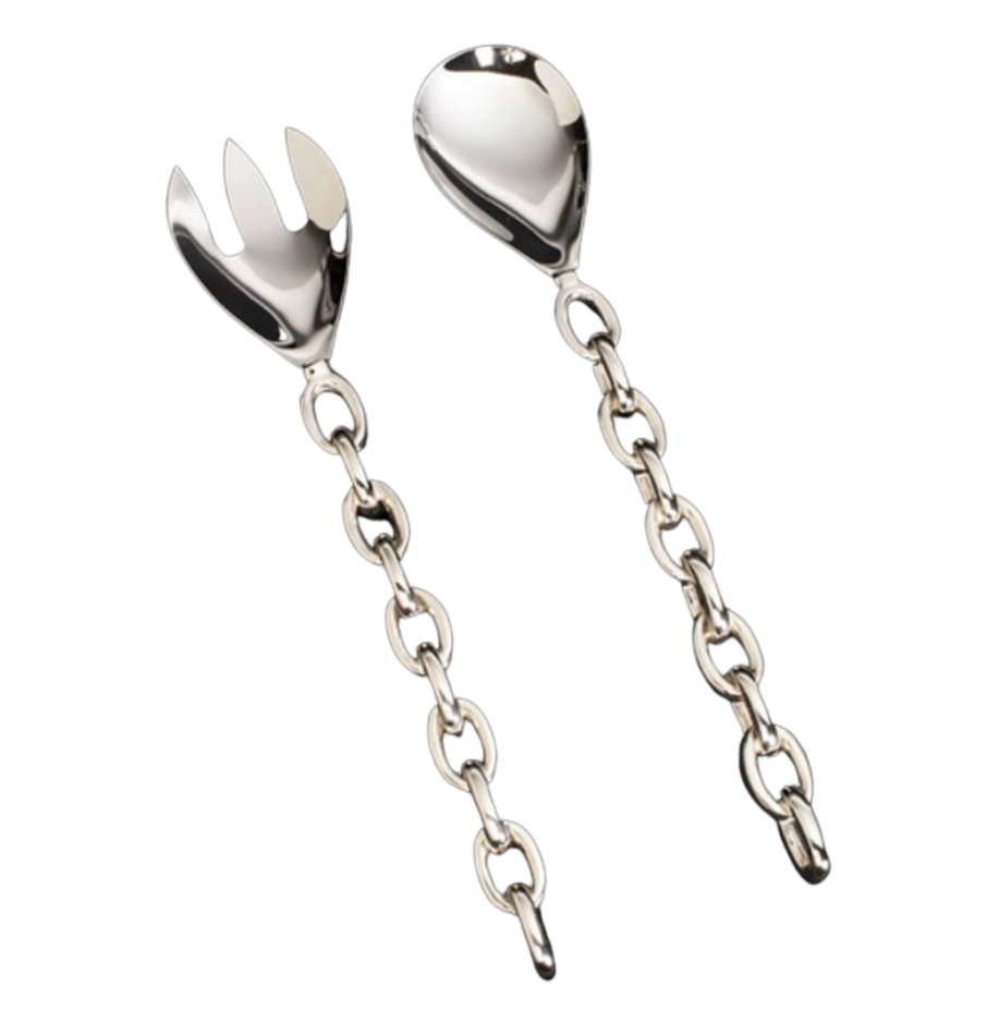 The Inspired Generations Linky Salad Set features handcrafted, polished aluminum servers with chain-link handles; includes one spoon and one fork.