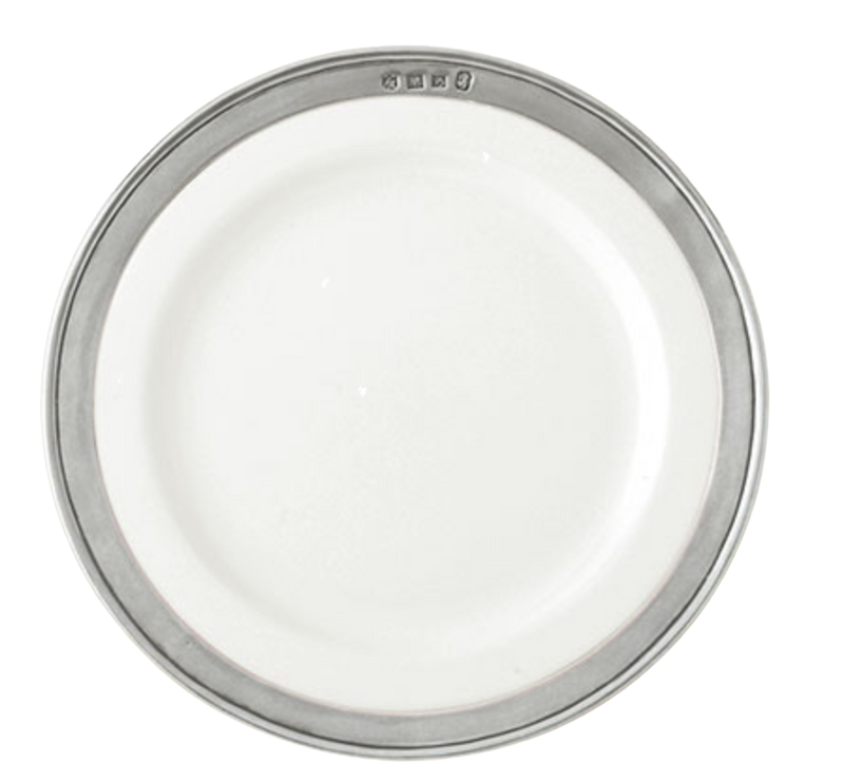 A round white plate with a metallic silver pewter rim and embossed symbols near the edge, photographed from above on a white background—an elegant MATCH Convivio ceramic dinnerware piece by MATCH.