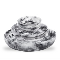Large, medium, and small black swirl resin round bowls. 