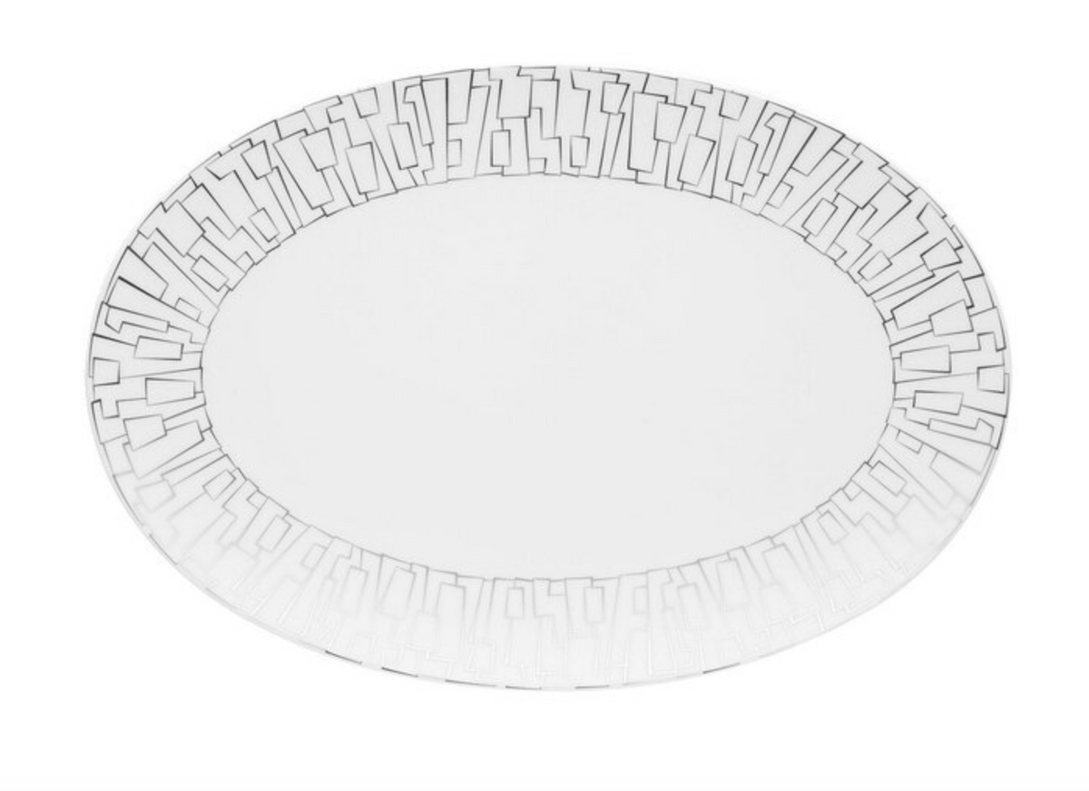 The Skin Platinum TAC 02 Dinnerware by Rosenthal features a white oval porcelain plate with geometric, maze-like platinum accents around the rim and an unadorned center.