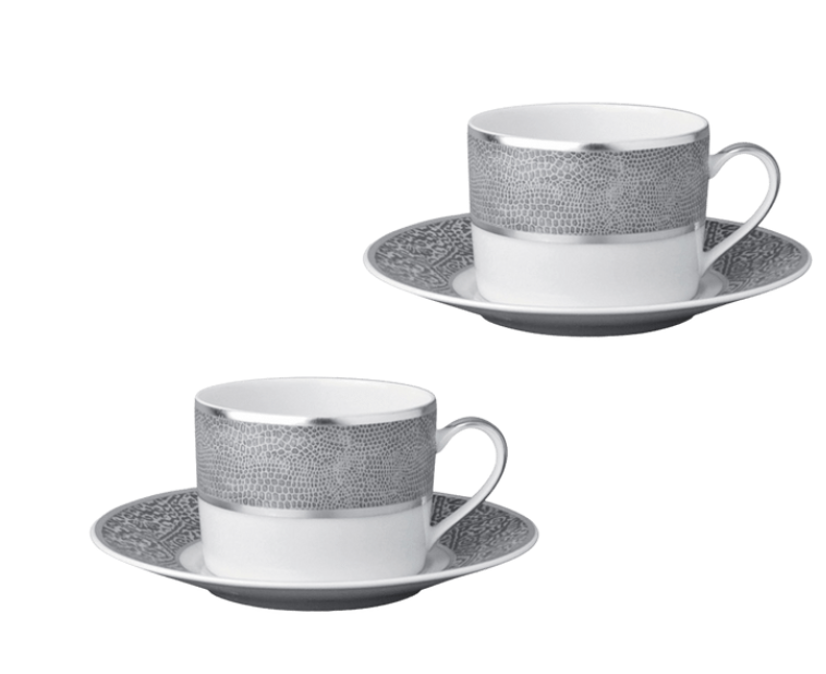 Two Bernardaud Sauvage Grey & Platinum teacups with handles and matching saucers, each adorned with a silver-gray platinum band resembling snakeskin. Elegant Limoges porcelain set on a plain white background.