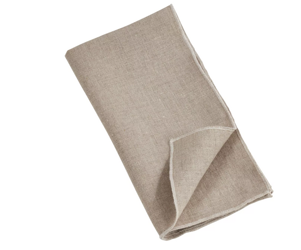A beige napkin from the Saro Trading Stitched Stone Washed Napkin Set of 4, featuring a visible textured weave and stitched border, is shown folded on a white background.