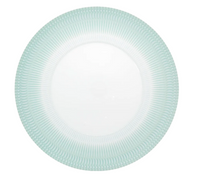 The Venezia Dinnerware by Vista Alegre is a round white porcelain plate with a smooth center and a textured, light blue-green rim featuring a scallop-like pattern.