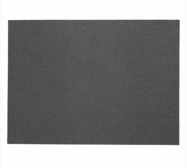 A set of four rectangular black placemats from Bodrum’s Skate collection, featuring a fine, gritty texture and displayed against a white background.
