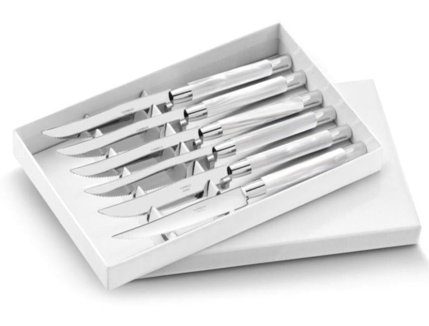 The Capdeco Conty Steak Knives Set of 6 features stainless steel, serrated blades, elegantly presented in a white box with the lid partially open.