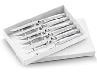 The Capdeco Conty Steak Knives Set of 6 features stainless steel, serrated blades, elegantly presented in a white box with the lid partially open.