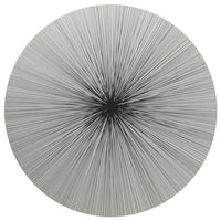 The Lines Placemat Set of 4 by Tisch New York features a circular black and white abstract design with radiating lines and a cork back, blending elegance and durability—perfect for adding luxury to any table setting.