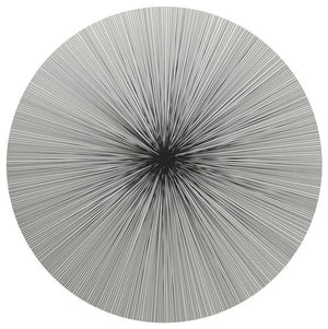 The Lines Placemat Set of 4 by Tisch New York features a circular black and white abstract design with radiating lines and a cork back, blending elegance and durability—perfect for adding luxury to any table setting.
