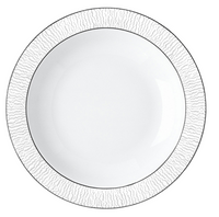The Dune Dinnerware dinner plate by Bernardaud features round white Limoges porcelain with a textured, wavy outer rim and a smooth center. Handcrafted, it's shown from above on a white background.