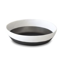 The Purist Duo Large Resin Bowl by Tina Frey features a round, shallow design with a black exterior and interior base, accented by a wide white band—an ideal contemporary centerpiece for your table.