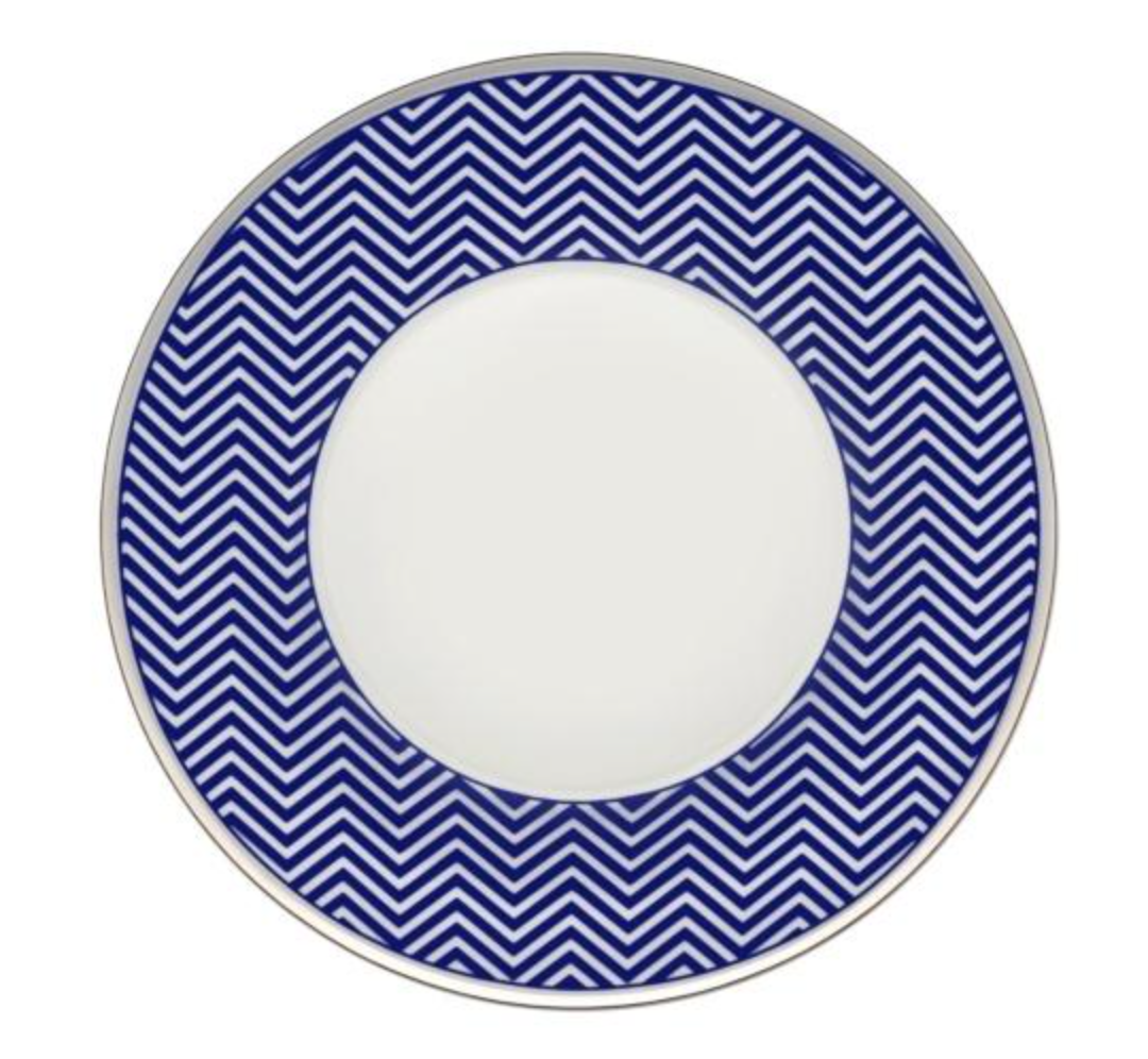 The Vista Alegre Harvard Dinnerware plate features a wide blue border with a white chevron pattern and a plain white center, offering classic New England style.
