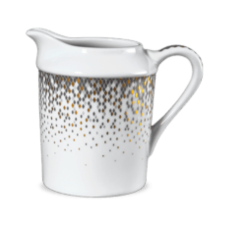 The Haviland Souffle D'or Dinnerware pitcher is crafted from white Limoges porcelain, featuring a handle and elegant gold and silver dots clustered near the top and fading as they flow downward.