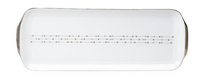 The Carrousel Dinnerware serving platter by Philippe Deshoulieres is a rectangular white Limoges porcelain piece with rounded edges and a simple dot-and-dash line across the center.