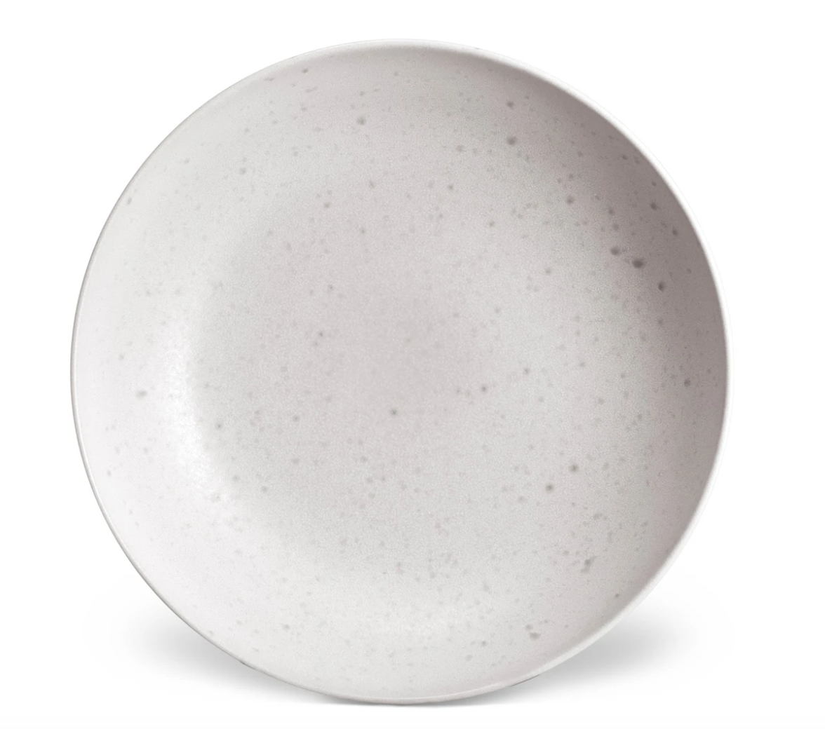 A round, shallow, light gray Terra Stone Dinnerware plate by L'Objet, featuring a subtle speckled pattern, is shown from above on a white background.