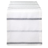 The Bodrum Metallic Band Silver Table Runner features a sleek, minimalist design with metallic silver bands, elegantly draped over the edge of a table.