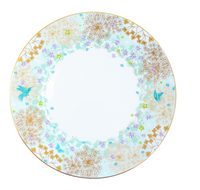The Fèerie By Michael Cailloux plate by Bernardaud features Limoges porcelain with a white center, blue, gold, and purple floral accents, golden dandelions, and two blue butterflies on the rim from the Fèerie Dinner Collection.
