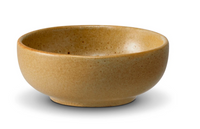 The Terra Leather Dinnerware by L'Objet is a small, round, light brown ceramic bowl with a smooth, slightly speckled glazed finish, shown on a white background.