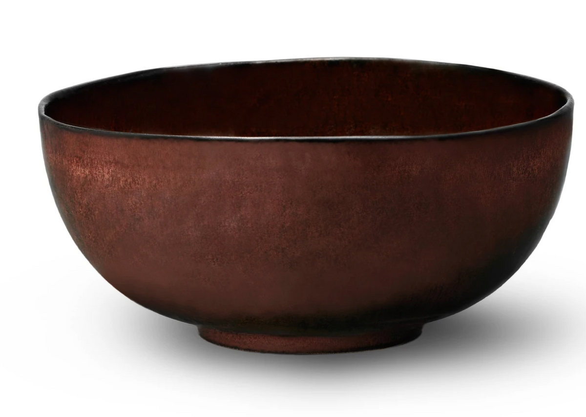 The Terra Wine Dinnerware by L'Objet is a handcrafted, rustic round brown ceramic bowl with a slightly rough texture, displayed against a white background.