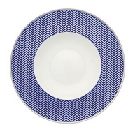 The Vista Alegre Harvard Dinnerware plate features a wide, deep blue zigzag chevron rim and a plain white center, blending classic New England style with elegant porcelain craftsmanship.