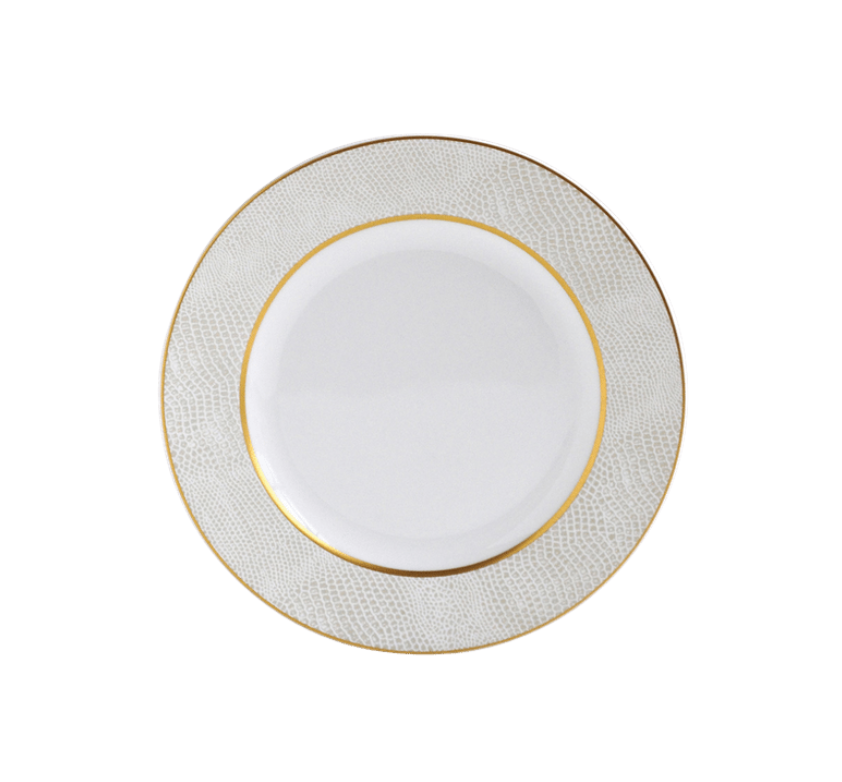 The Sauvage Gold Dinnerware by Bernardaud features a white Limoges porcelain plate with a textured, embossed snakeskin rim and gold trim border. Its center is plain white. The plate is shown from above on a white background.