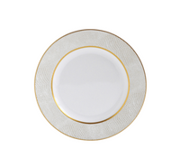 The Sauvage Gold Dinnerware by Bernardaud features a white Limoges porcelain plate with a textured, embossed snakeskin rim and gold trim border. Its center is plain white. The plate is shown from above on a white background.