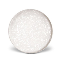 The Alchimie Dinnerware White by L'Objet is a round, white ceramic plate with a subtle speckled pattern, seen from above on a plain white background—a modern, luxury tableware piece that’s dishwasher safe.