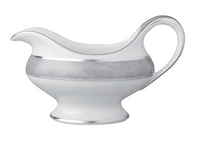 The Bernardaud Sauvage Grey & Platinum gravy boat is crafted from white Limoges porcelain, featuring a wide spout, curved handle, and a platinum snake skin-embossed band.