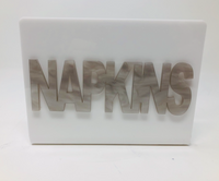 The Eye Candy Acrylic Napkin Holder features bold, marble-patterned "NAPKINS" lettering cut out on the front for a stylish, modern touch.