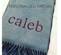 The A Soft Idea Personalized Throw Blanket in light blue features "Caleb" embroidered in maroon and a fringe edge, with "PERSONALIZED THROWS" at the top—a perfect custom addition to any space.